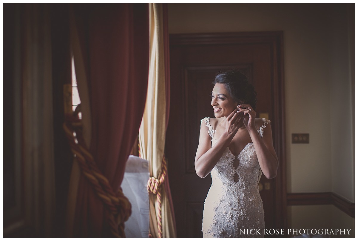  Bride getting ready for her Indian civil wedding at Stoke Park Hotel in Buckinghamshire 