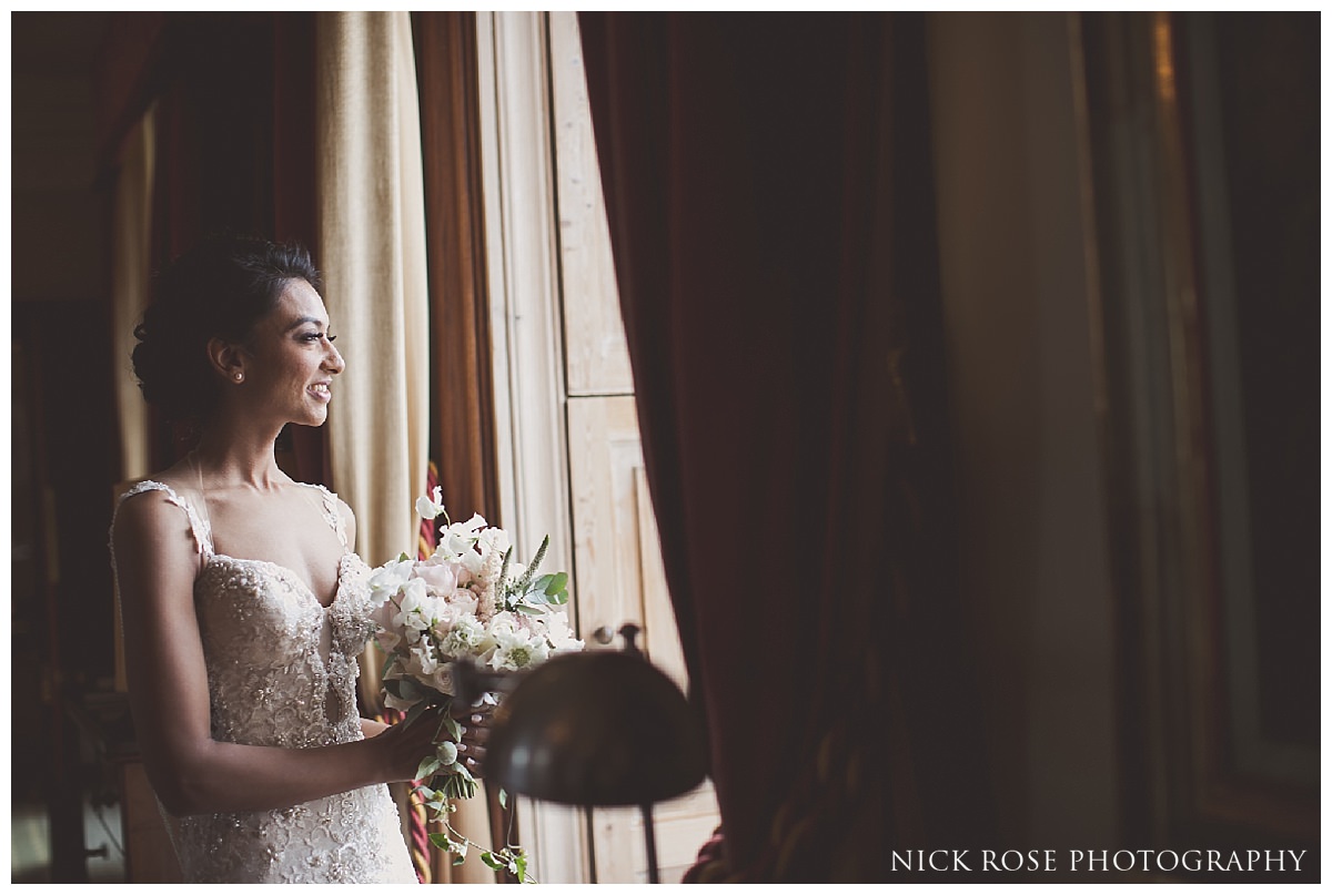  Bride getting ready for her Indian civil wedding ceremony at Stoke Park in Buckinghamshire 