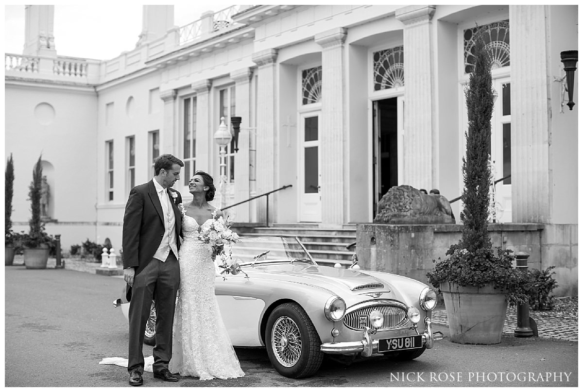  Bride and groom wedding photographs at Stoke Park Hotel in Buckinghamshire 