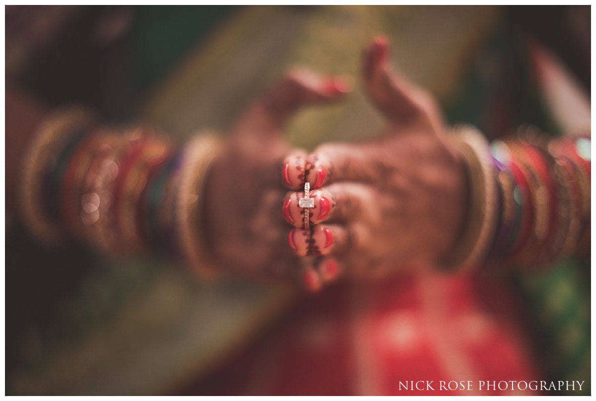 Hindu bride holding her wedding ring before an Indian wedding at the Oshwal Centre in Potters Bar London