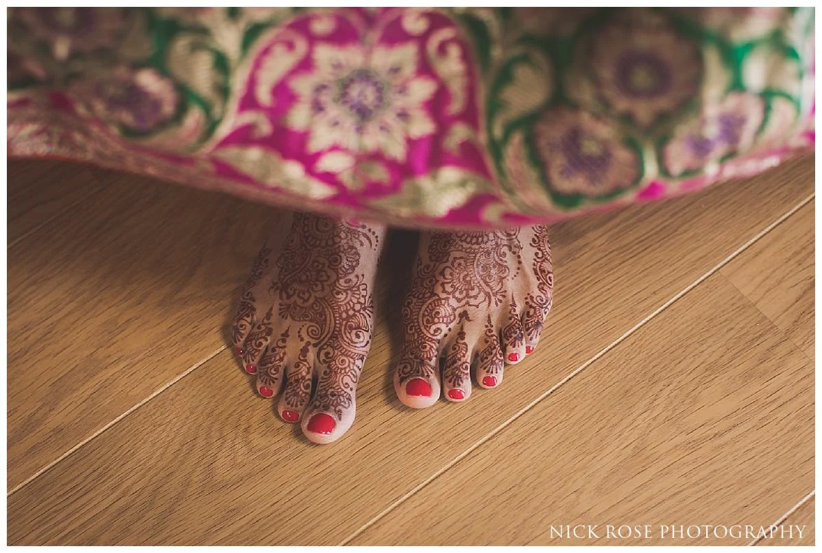 Indian bride's feet with henna on