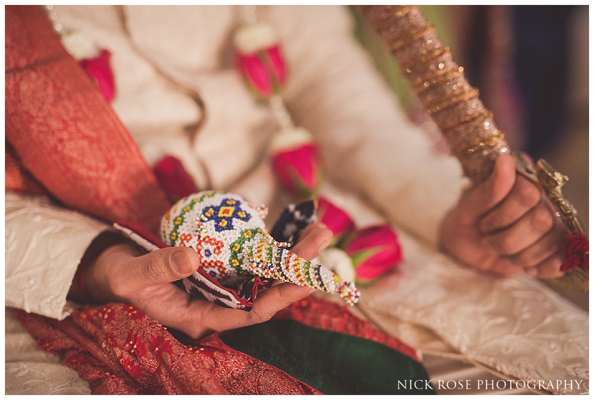  Groom hindu religious ceremony before a Hertfordshire Indian wedding at the Oshwal Centre 