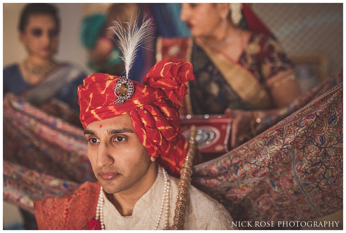 Groom turban tying before a Hertfordshire Indian wedding at the Oshwal Centre 