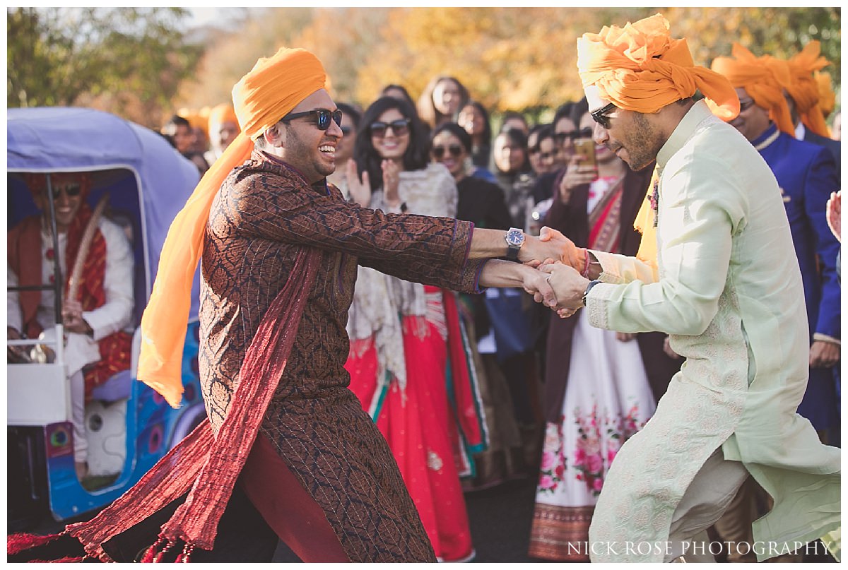 Hindu wedding baraat entrance and dancing at the Potters Bar Oshwal Centre in Hertfordshire