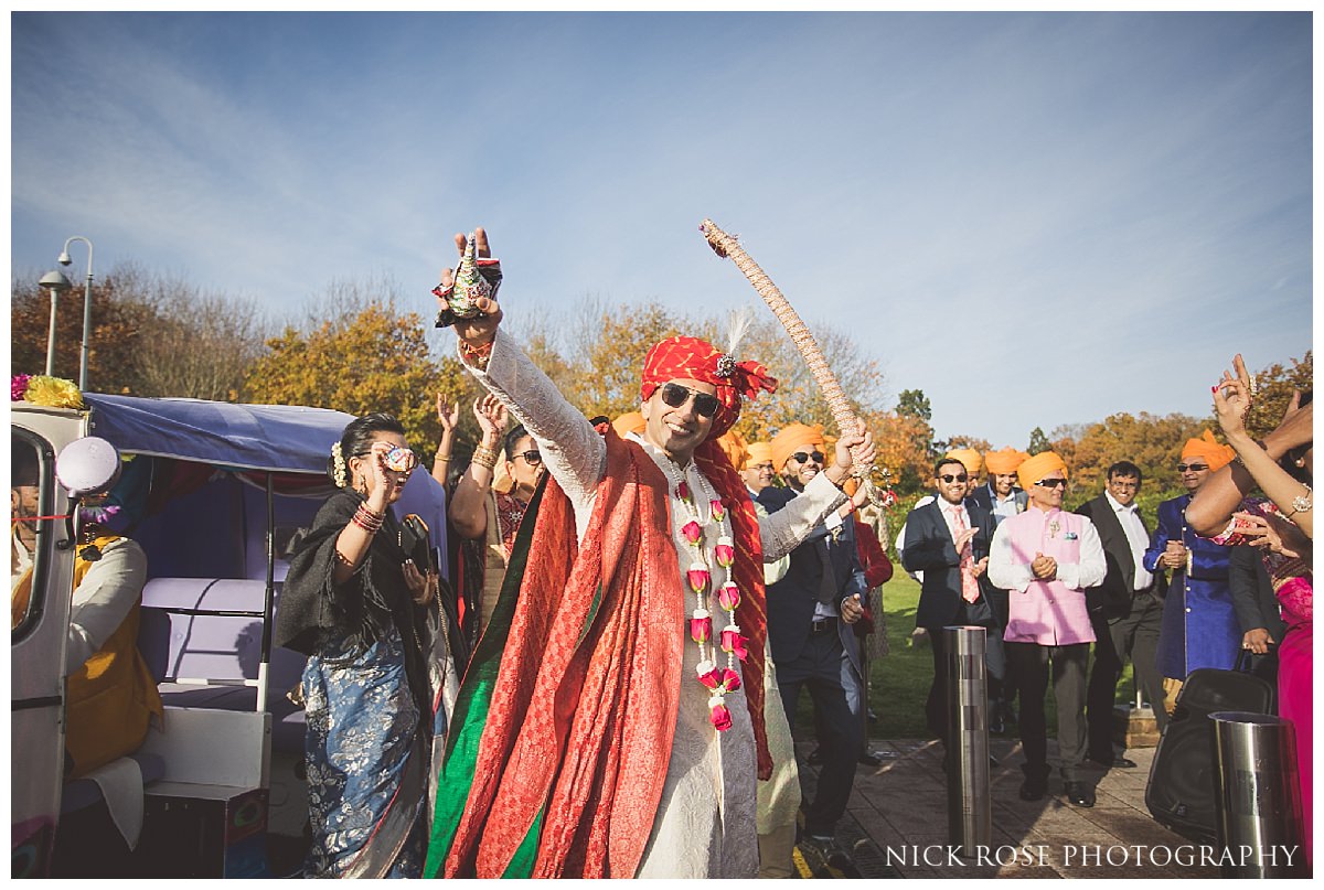 Groom wedding baraat entrance at the Potters Bar Oshwal Centre in Hertfordshire