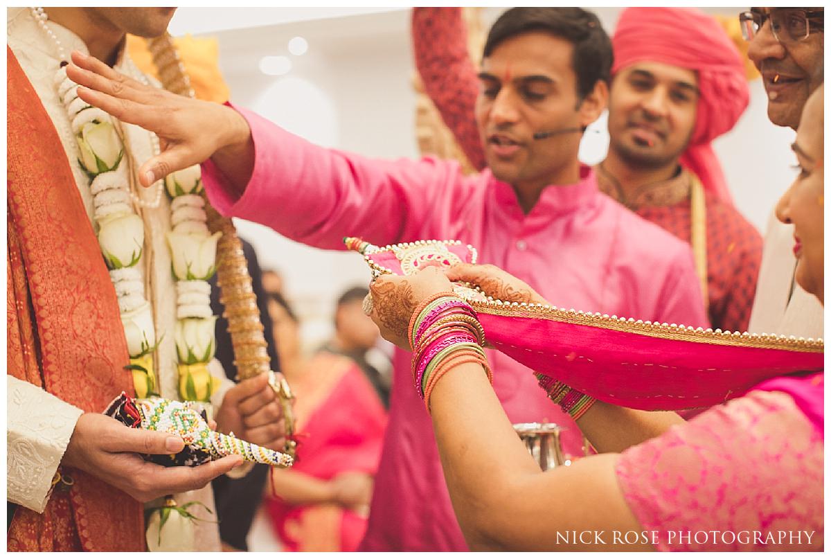  Indian wedding ceremony with hindu priest Kamal Pandey at the Potters Bar Oshwal Centre in Hertfordshire 