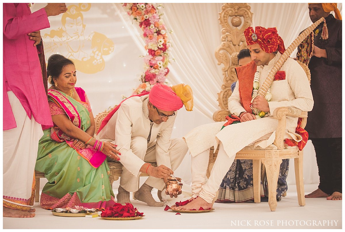 Indian wedding ceremony with hindu priest Kamal Pandey at the Potters Bar Oshwal Centre in Hertfordshire