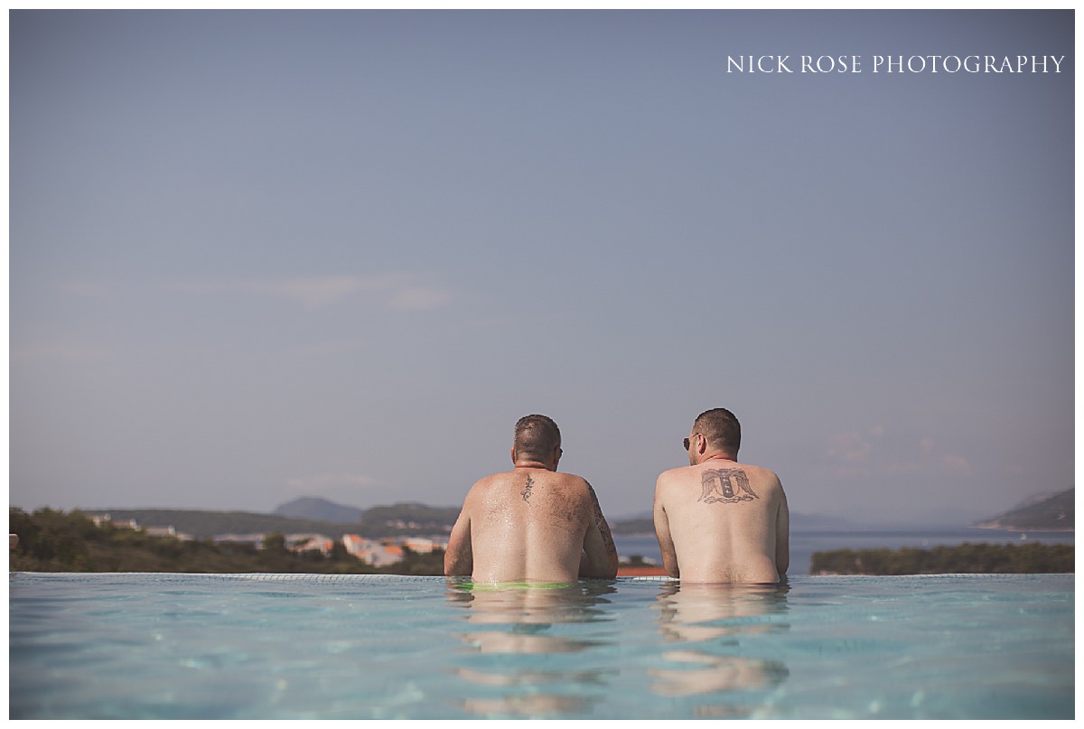  Groomsmen relaxing in the swimming pool before a Dubrovnik Palace Wedding in Croatia 