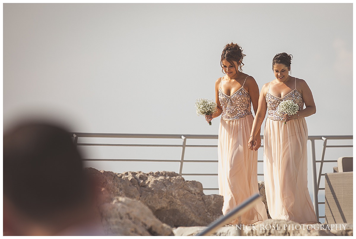  Bridesmaids walking towards the isle for a destination wedding in Croatia at Dubrovnik Palace Hotel  