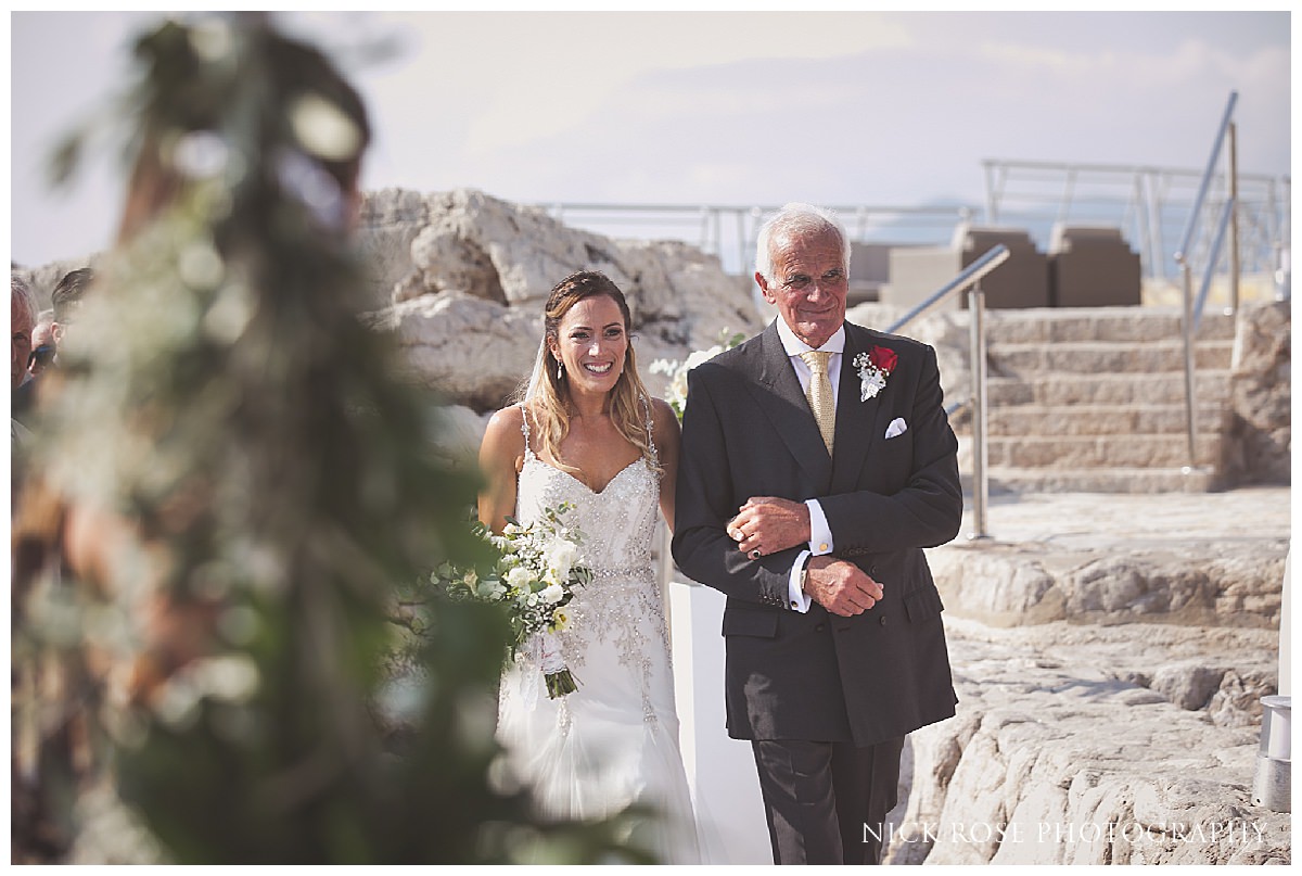  Bride walking down the isle for a destination wedding in Croatia at Dubrovnik Palace Hotel  