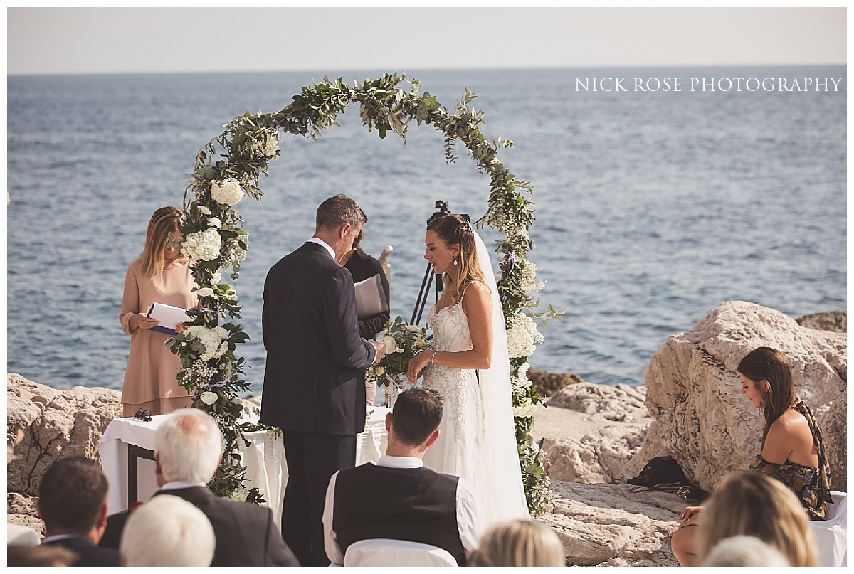    Couple exchanging vows at the scenic outdoor location in Dubrovnik   
