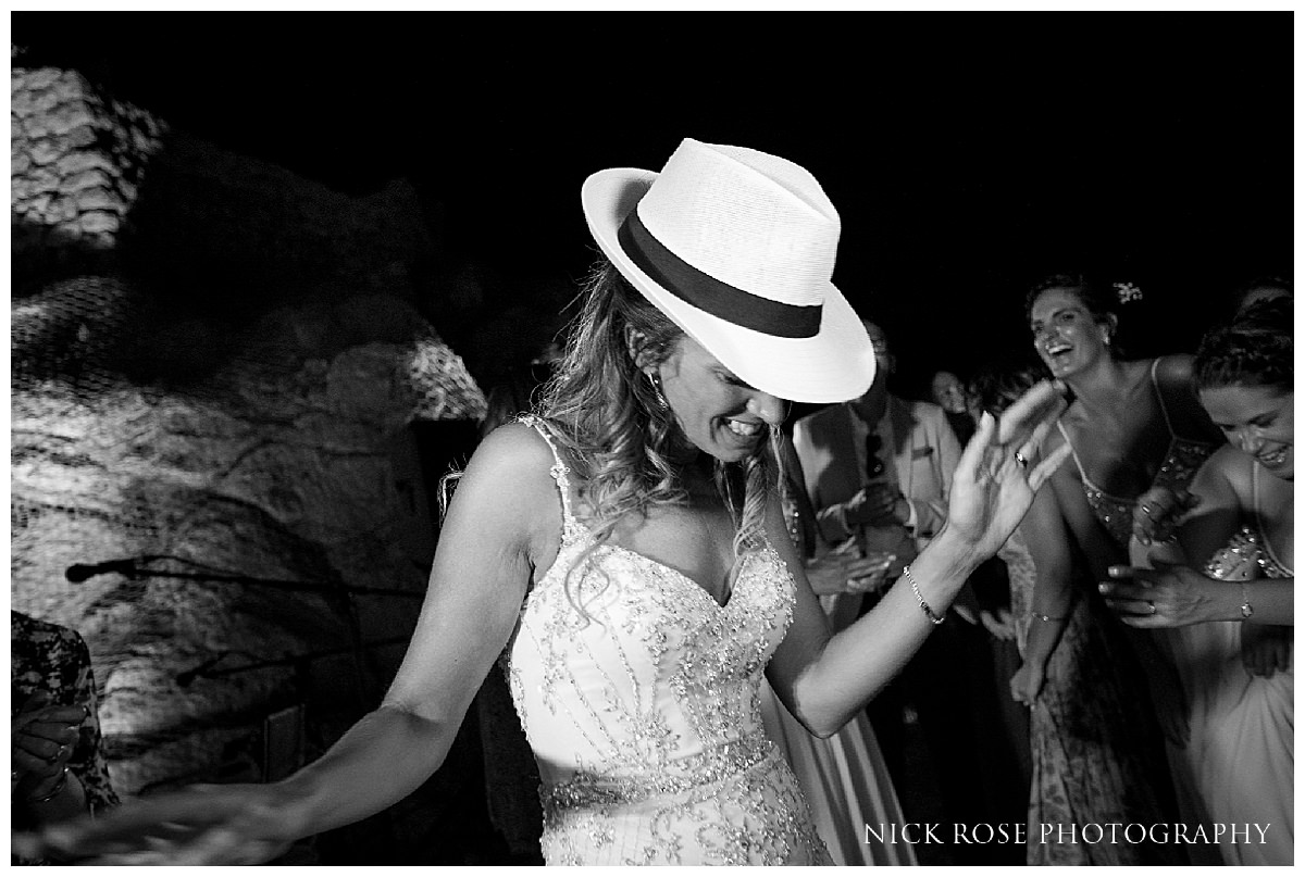  Bride dancing by the pool at a destination wedding at Hotel Dubrovnik Palace in Croatia 