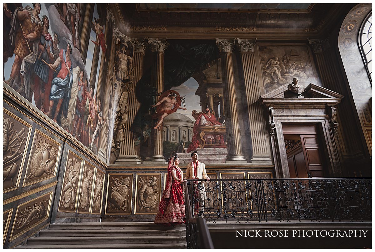  Bride and groom on the Kings Staircase at Hampton Court Palace for an Indian Hindu Wedding 