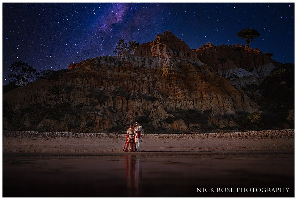  Bride and groom night portrait on the beach under the stars at the Pine Cliff resort hotel in Portugal photographed by International wedding Photographer Nick Rose 