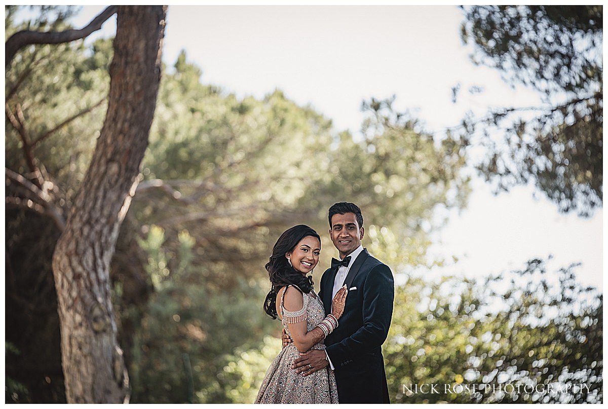  Bride and groom reception portraits at their Indian wedding at the Pine Cliff resort hotel in Portugal photographed by International wedding Photographer Nick Rose 