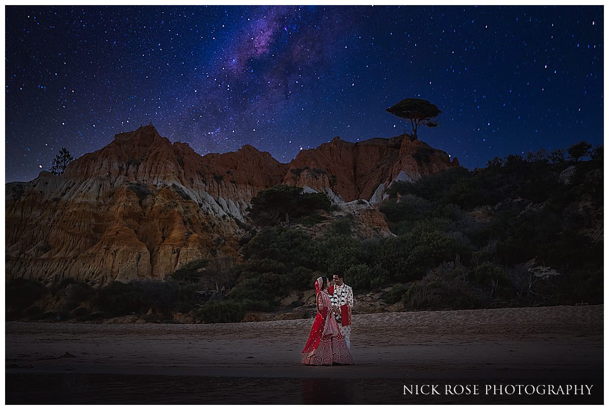  Bride and groom night portrait on the beach under the stars at the Pine Cliff resort hotel in Portugal photographed by International wedding Photographer Nick Rose 