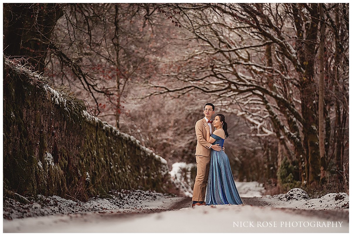  Winter engagement pre wedding session in Scotland surrounded by trees and snow 