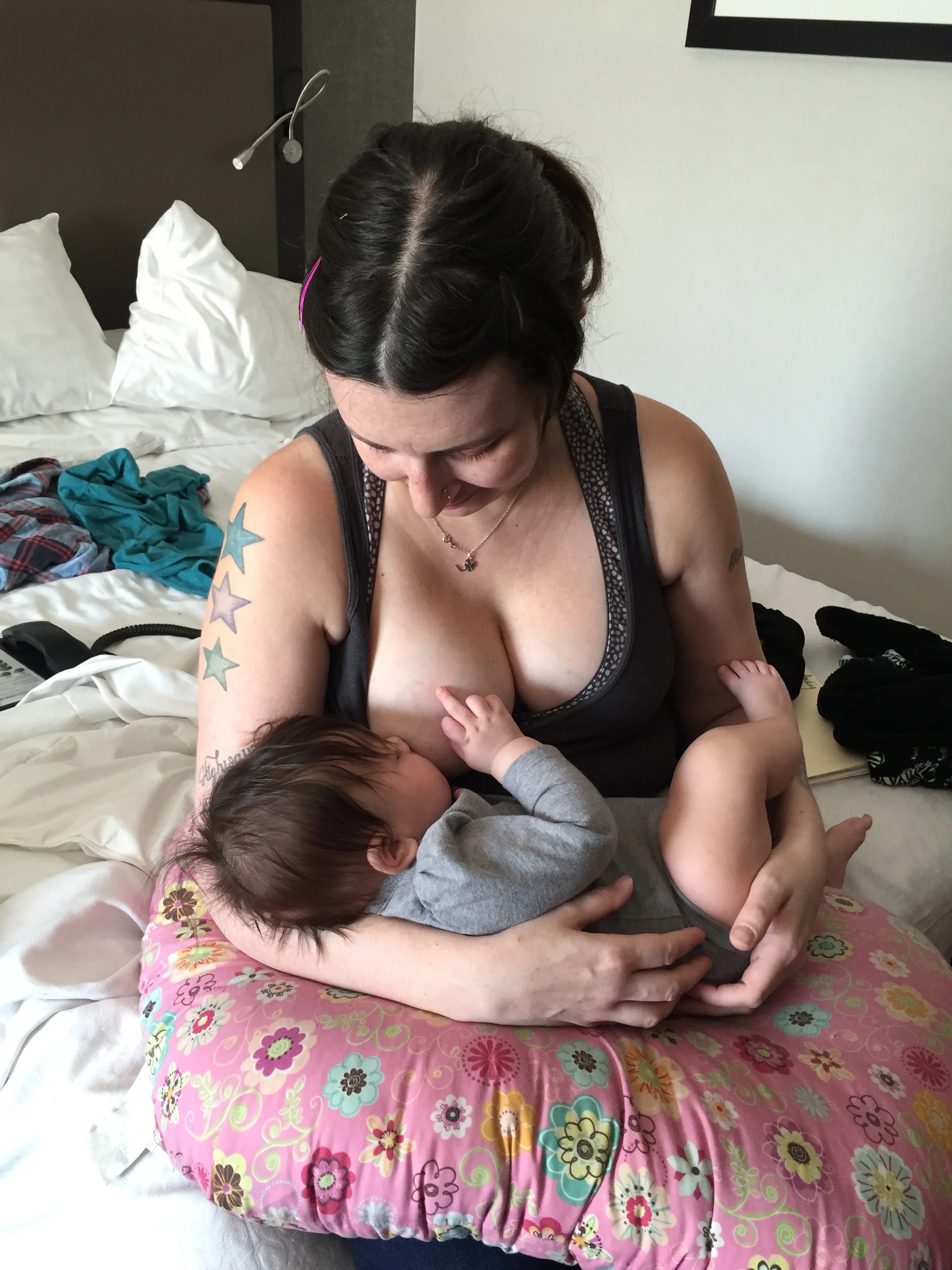 Nursing Aurora in our hotel room on the LES right before we left for California. I didn't put her finger there, promise!