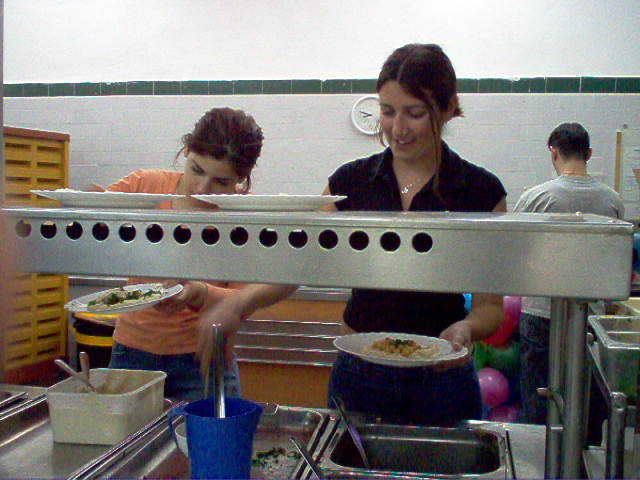 Serving hummus on the "vegetarian" cart