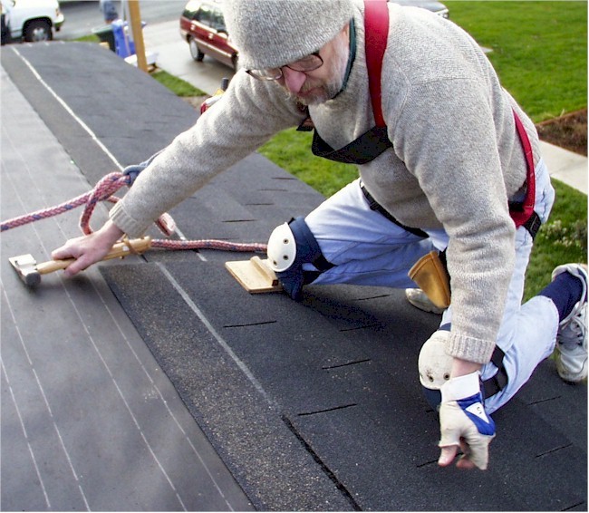 Roofer on knees setting three tab copy.jpg