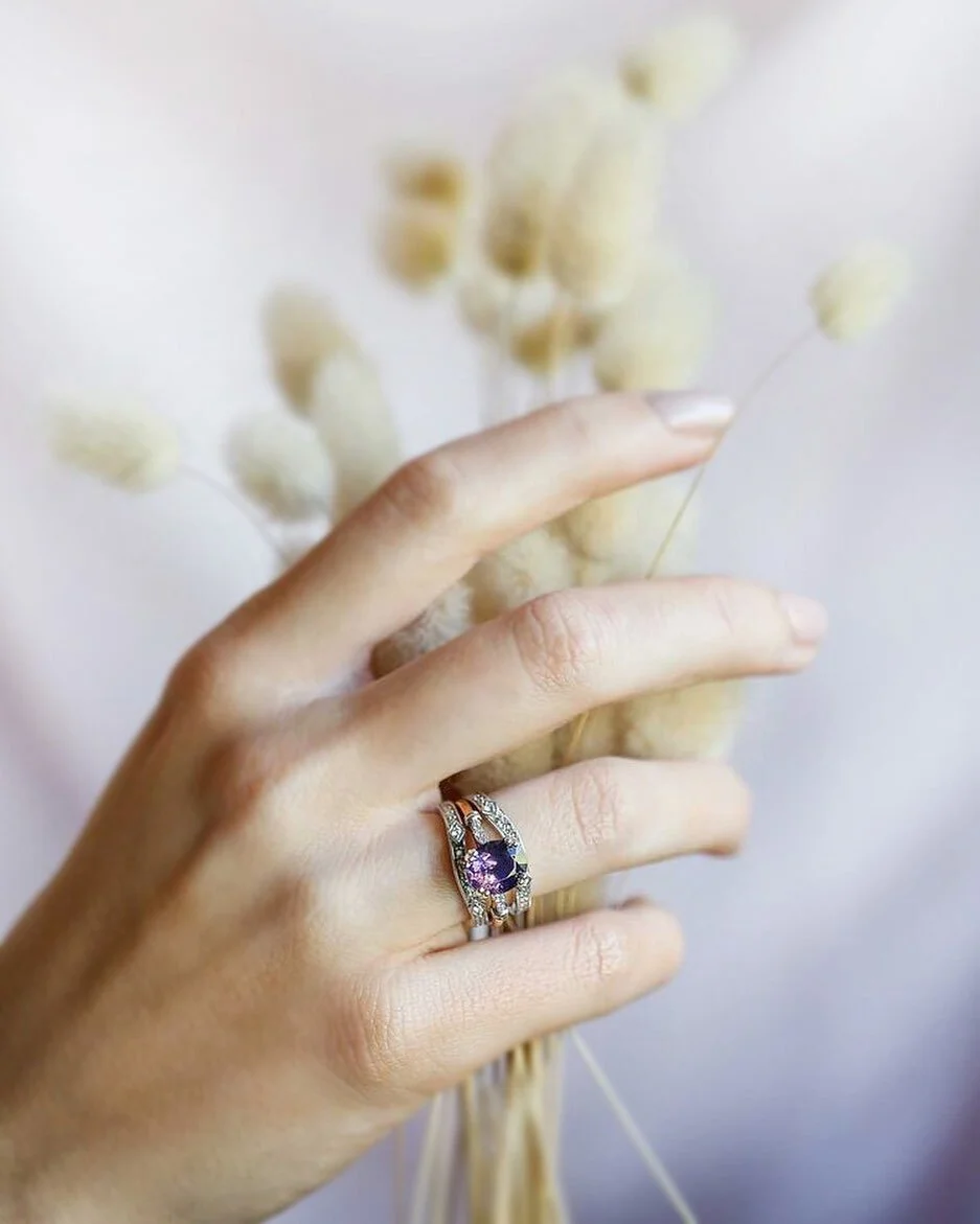 We&rsquo;re crushing on Victoria&rsquo;s sparkling deep purple spinel Firebird this morning, stacked here with two 18ct white gold and diamond curved Belle Époque Bands 😍 Tap the image for more info!
.
.
#spinel #gemstonerings #ringsofinstagram #purplespinel #designerjewellery #desigerring #uniquerings #sydneyengagementrings #sparkle