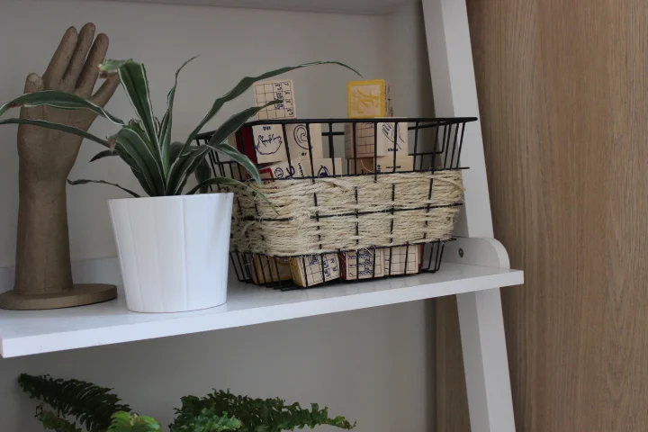 Weave twine around a wire basket to soften its edges