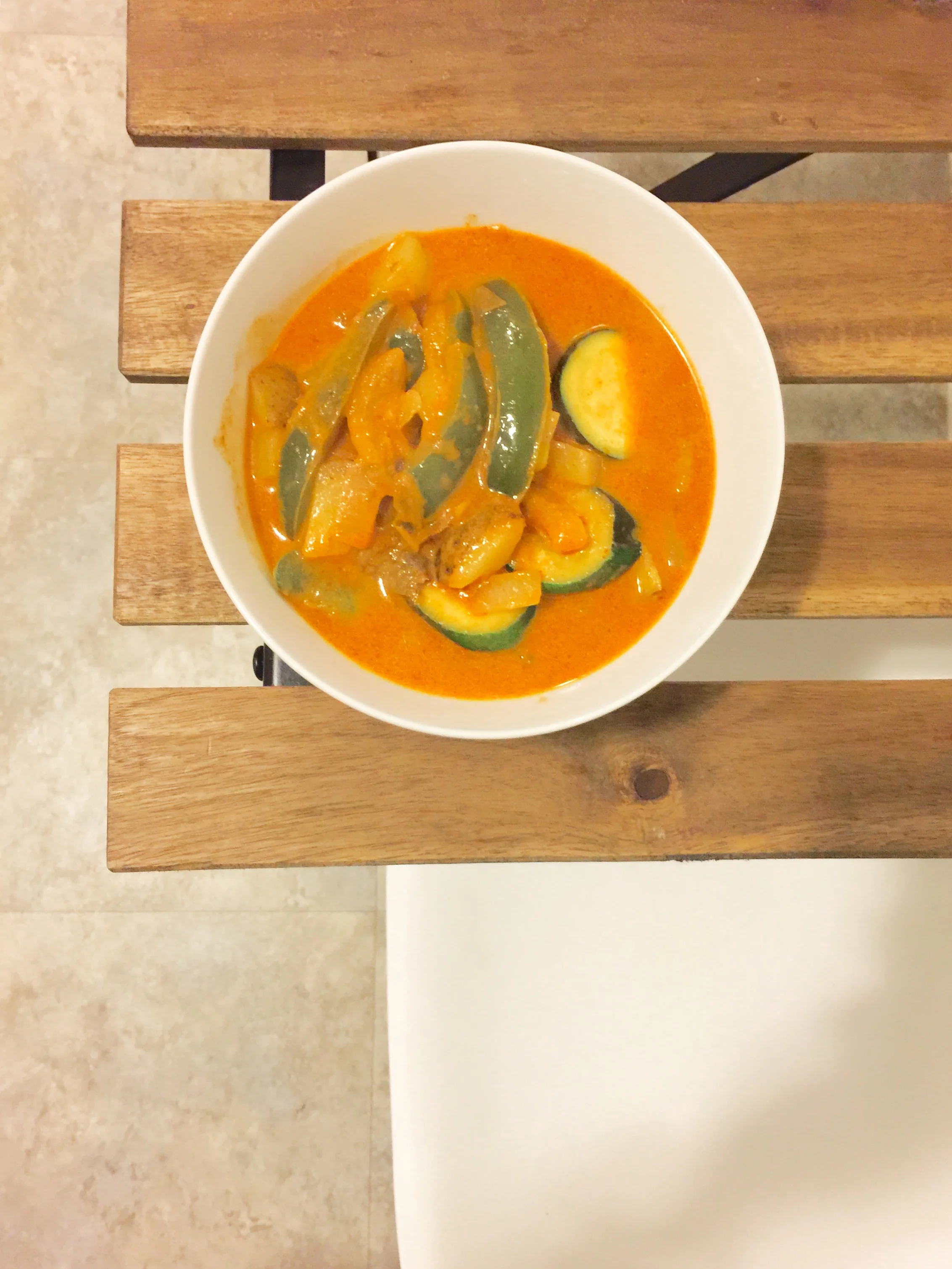 Red curry with zucchini, peppers, onions, and potatoes