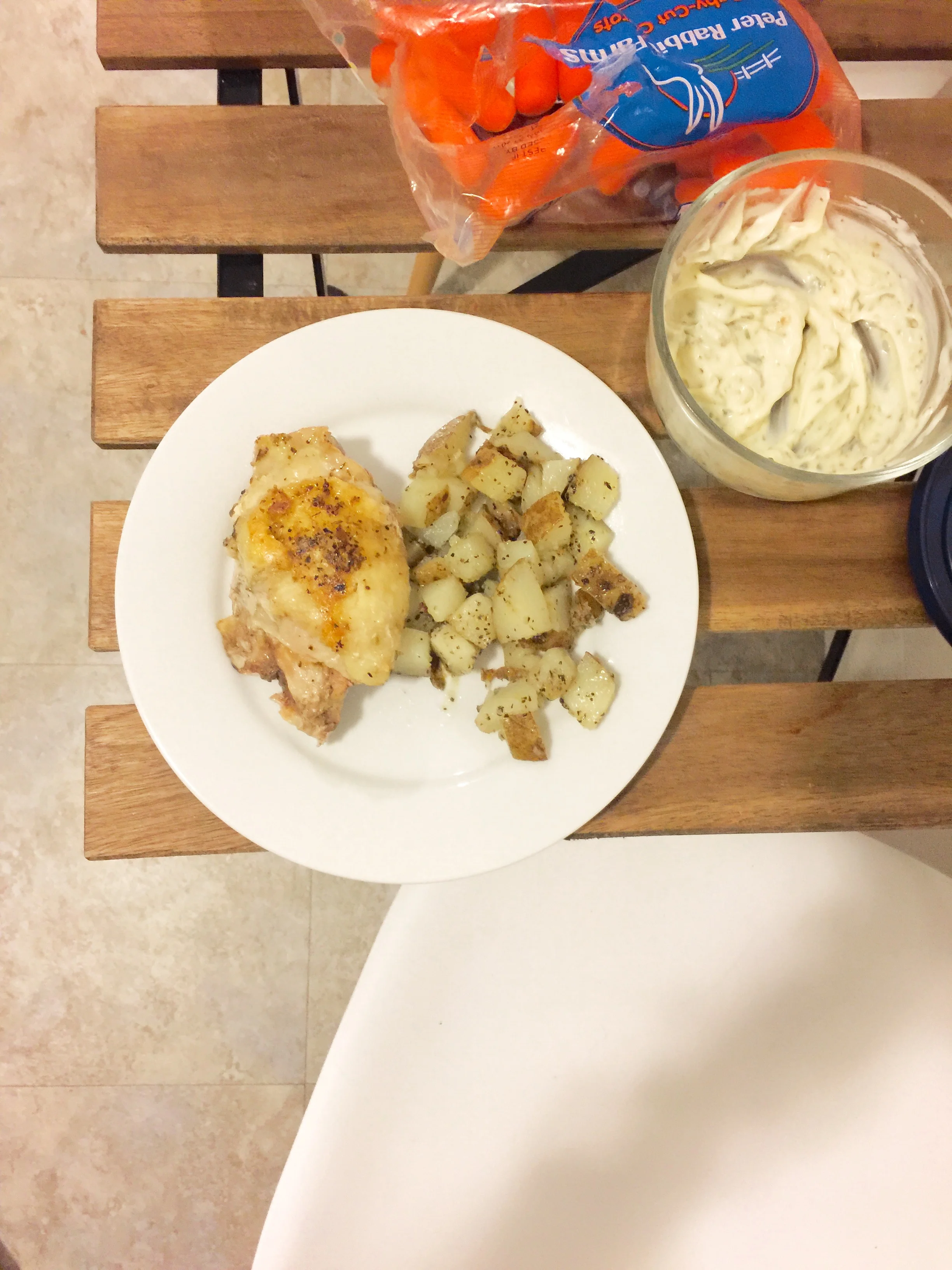 Seasoned Chicken thighs with potatoes and carrots and ranch 