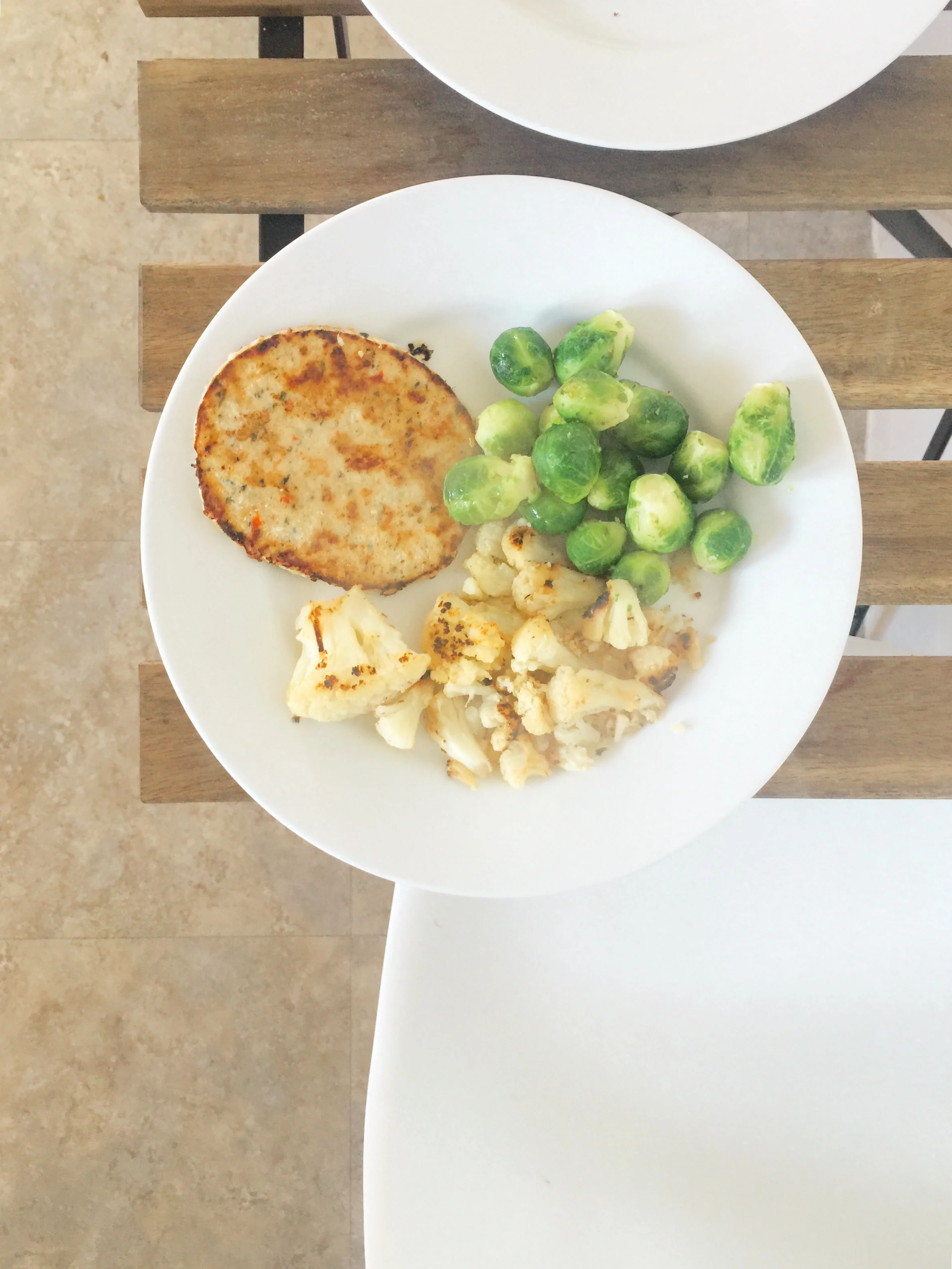 Trader Joe's Chili Lime Chicken Burger, Trader Joe's Grilled Cauliflower, and Brussels Sprouts. I used spicy mustard for dipping. 
