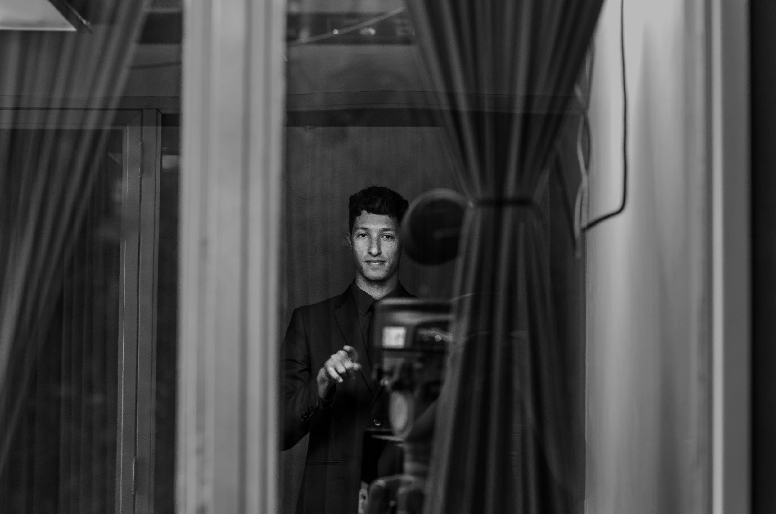 A man records a live speech in sign language.
