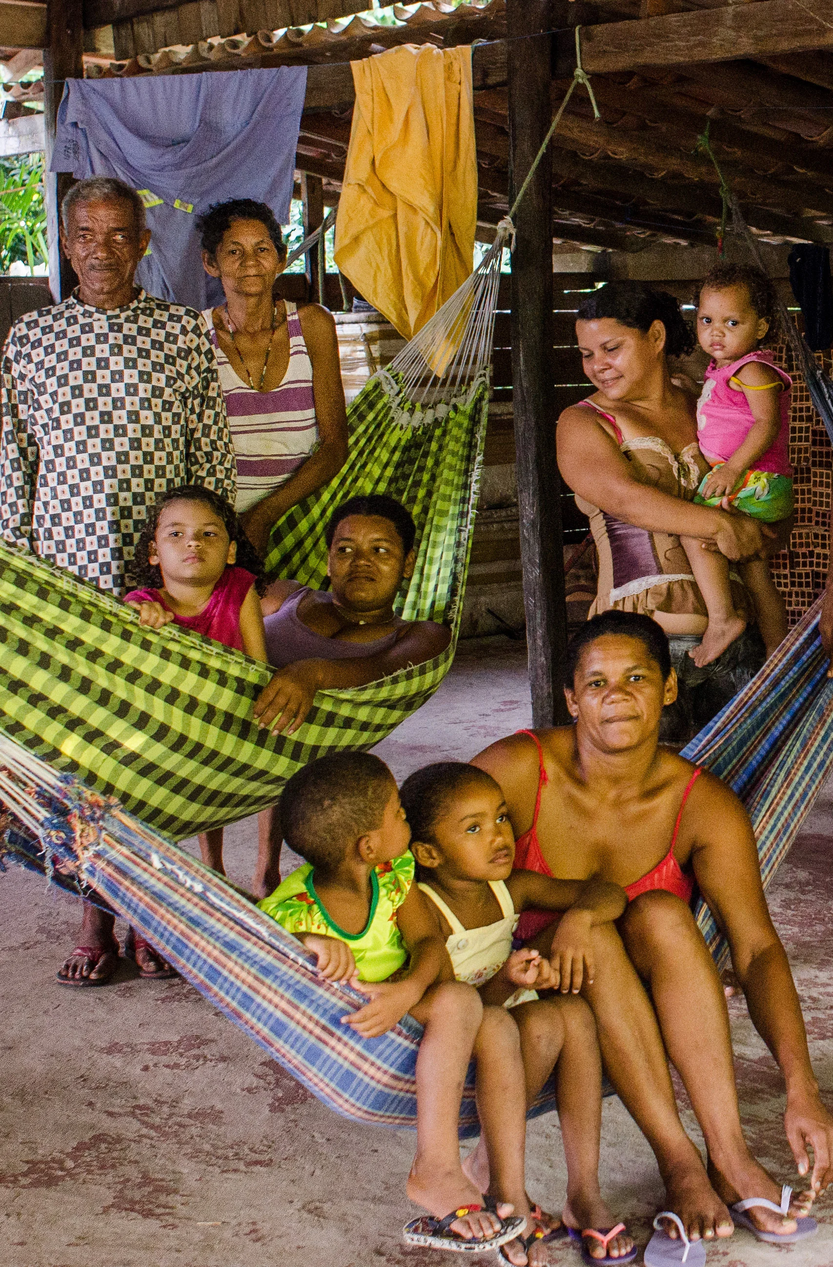 A handful of the family members who live with Uncle Black and Neuze. These are the hammocks they string up at night to sleep in, or lounge in during the day.