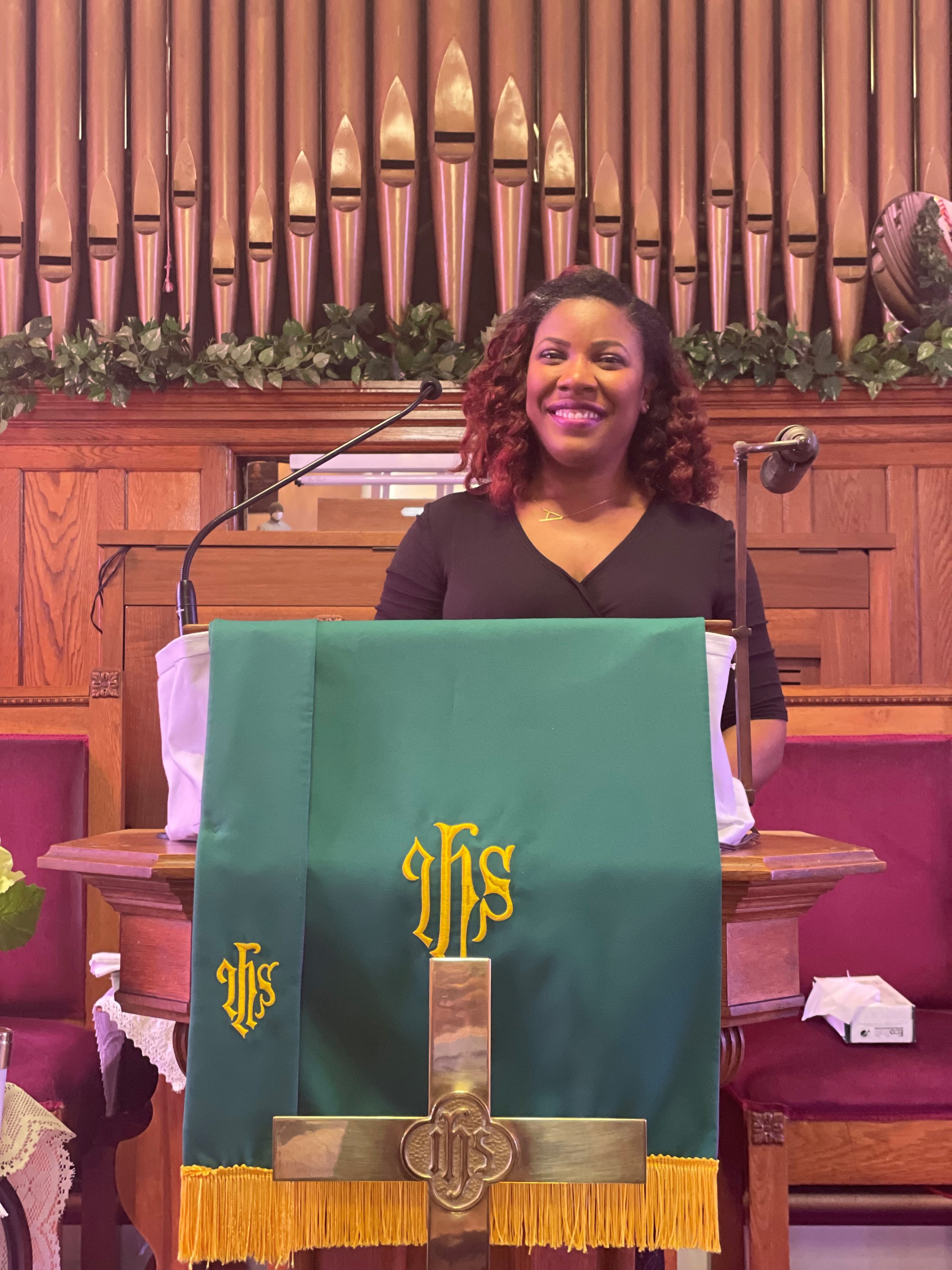Andrea Price At Pulpit.jpg