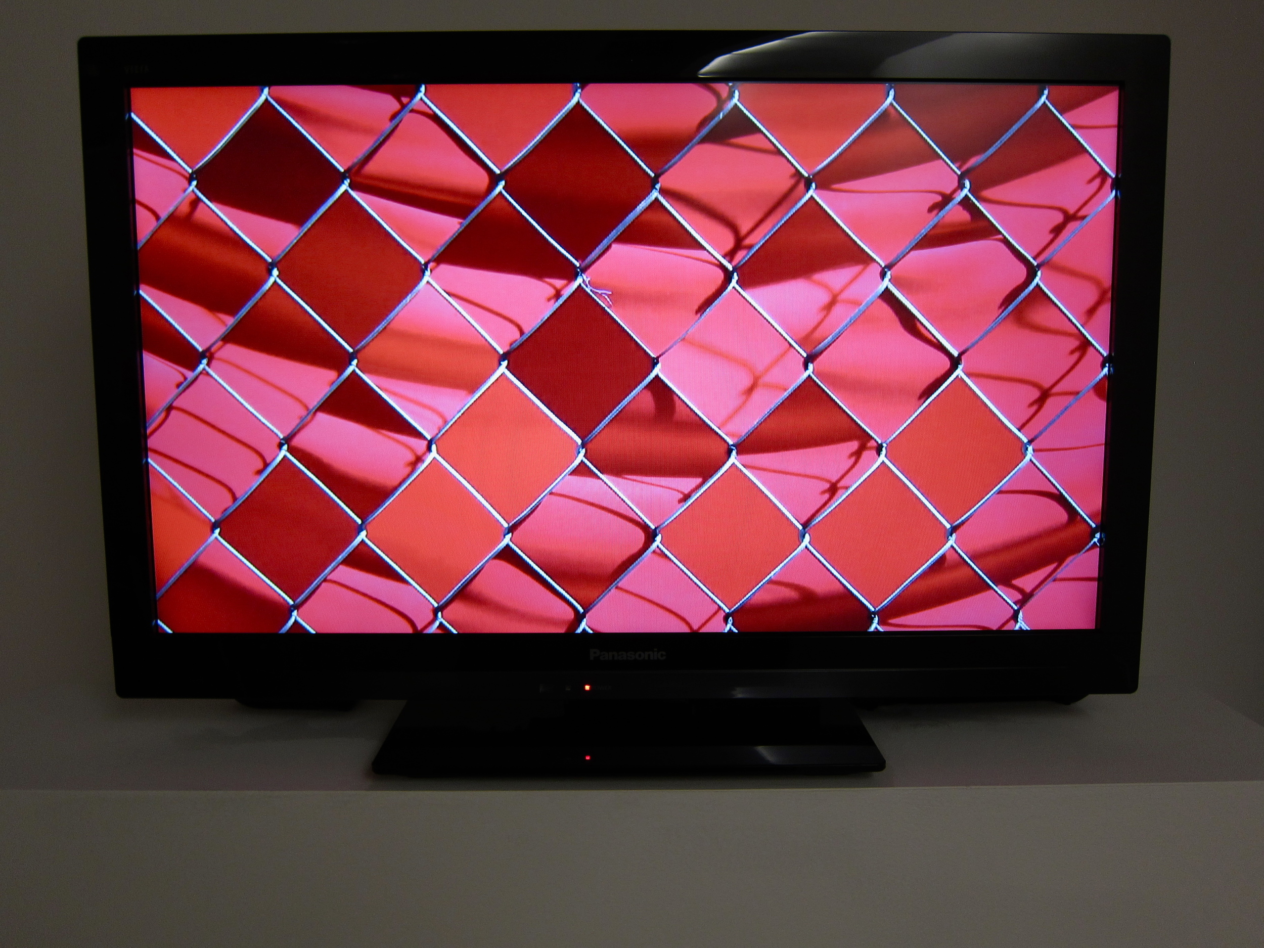  Noah Klersfeld OCCLF (chain-link fence, orange fabric) Edition of 5 HD Video (5 minutes) 27" x 16" (monitor size) 2012 