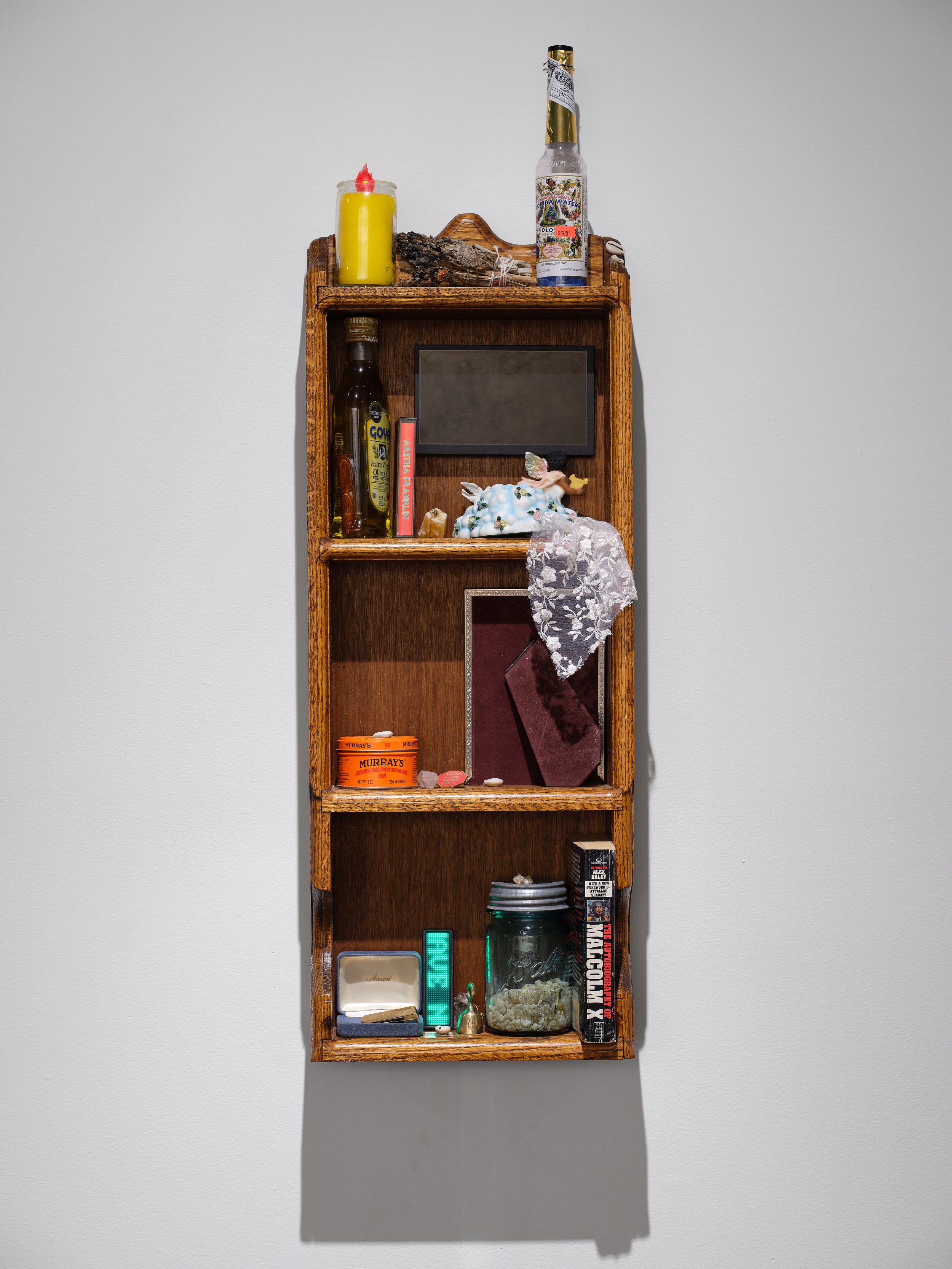 DaeQuan Alexander Collier, ALONEEEEEE / YOU HAVE NOT UNLESS YOU ASK NOT , 2025, Wood, objects in various media, standard-definition video (color, sound; 1:51 min.), LCD monitor, 36 x 24 x 3 inches