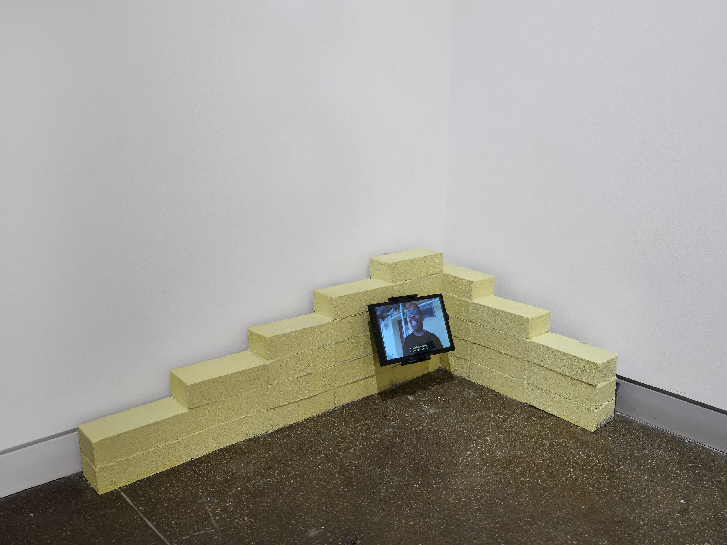 DaeQuan Alexander Collier, AN ORAL HISTORY , 2025, Concrete, wood, cement, standard-definition video (color, sound; 13:25 min.), LCD monitor, 38 x 26 x 14 inches