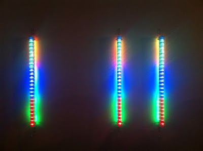   Chris Rice,   99 ¢ ,  2010. Light Installation. Each column 48 x 3 x 4 inches, overall dimensions variable. Courtesy of the artist. 