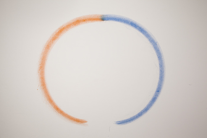   Rossana Martinez,   See the World in Orange and Blue,  2011. Series of momentary performances, orange and blue woodless colored pencils, paint, hands, wall, sketchbook, and paper. 