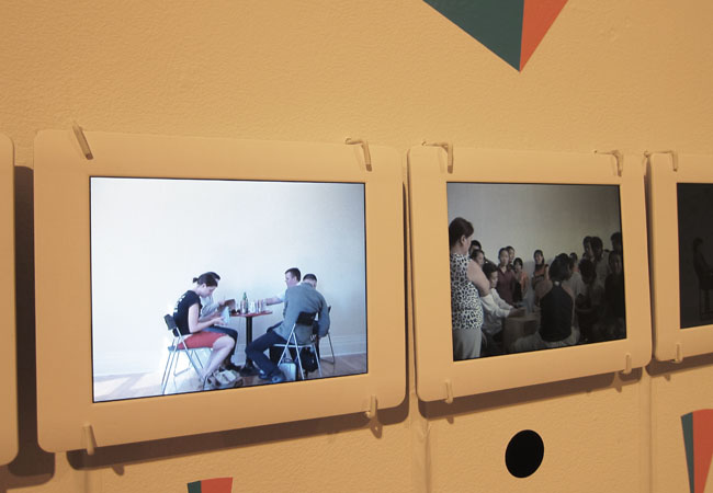   Elisabeth Smolarz,   The One Hundred Dollar Project , 2012. Video installation with vinyl decals. 