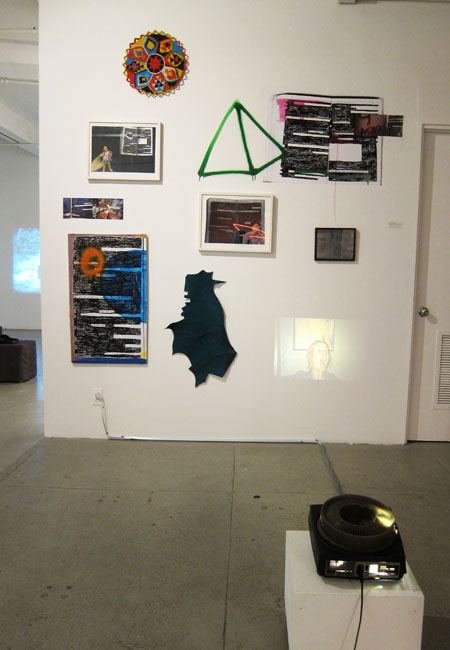   Juliana Irene Smith,   He said he could not understand me. I repeated,  2011. Installation with collage, objects, a black and white print and slide projector. 