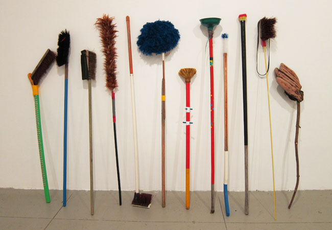   Matthew Cowan,   I’ll Sweep Your House: An Installation of Ritual Brooms,  2008-12. Brooms.   