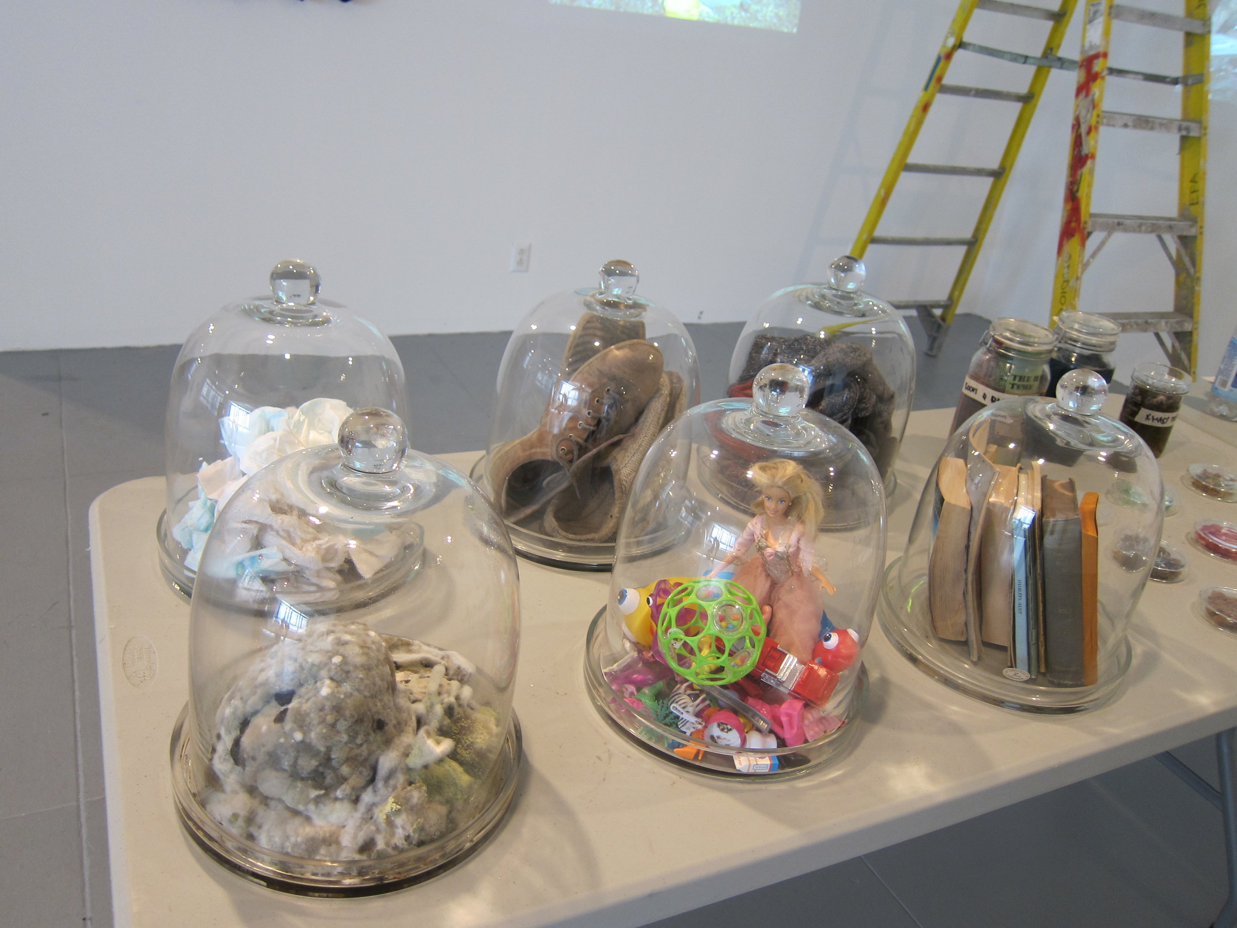   Kristyna Milde and Marek Milde,   Cabinet of Smells,  2014-15. Installation of perfume bottles and cleaning supplies and distillation station. Dimensions variable. 