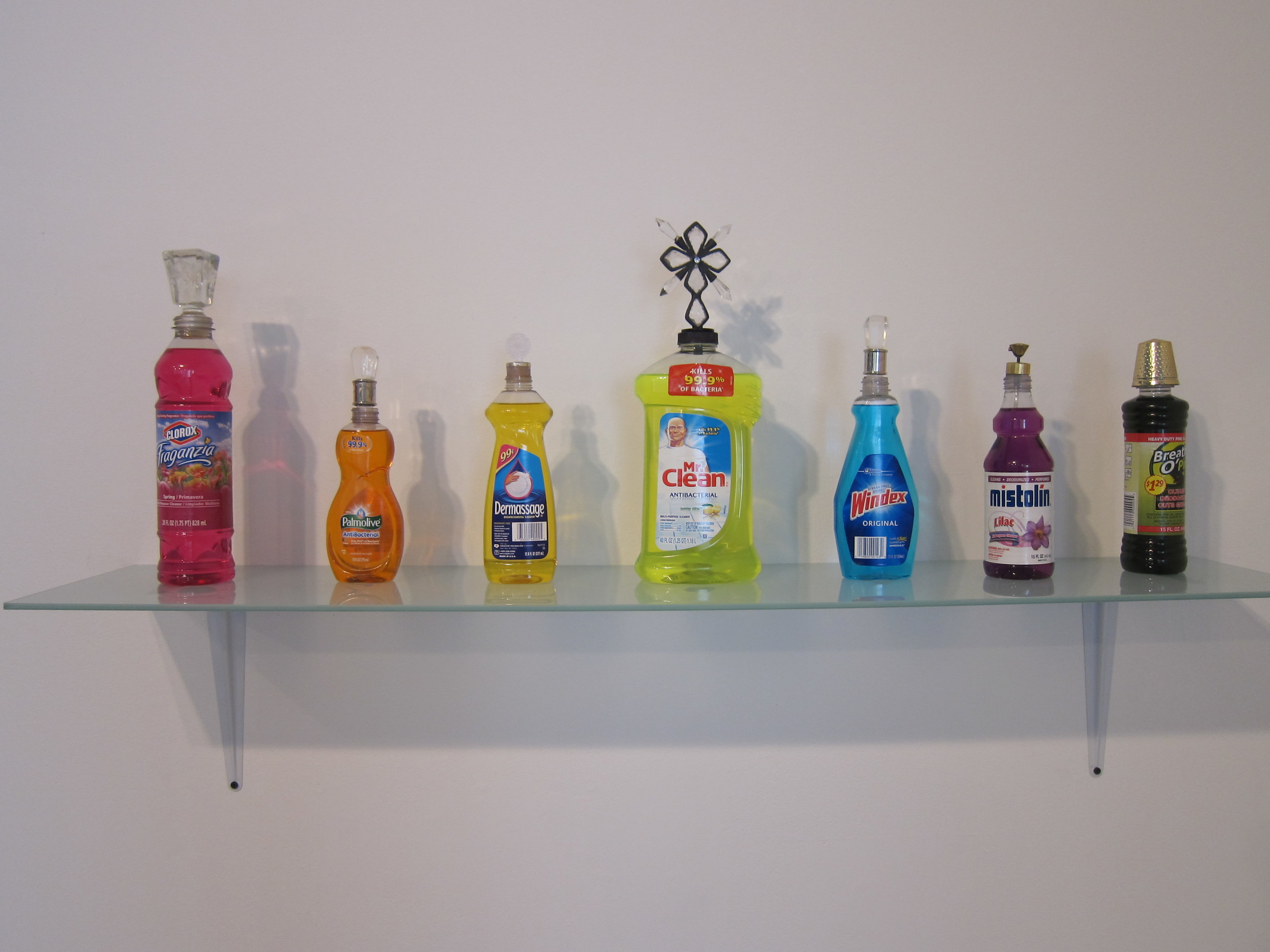   Kristyna Milde and Marek Milde,   Cabinet of Smells  (detail) ,  2014-15. Installation of perfume bottles and cleaning supplies and distillation station. Dimensions variable. 