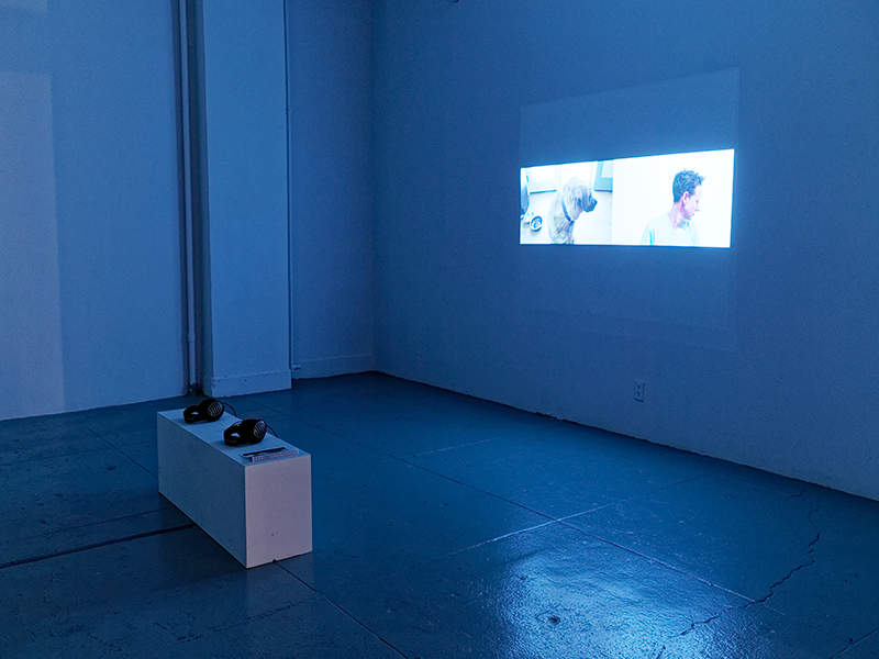   Kerry Downey,   Fishing with Angela,  2015 - 2016. Single channel video projection, 11:27 minutes. 