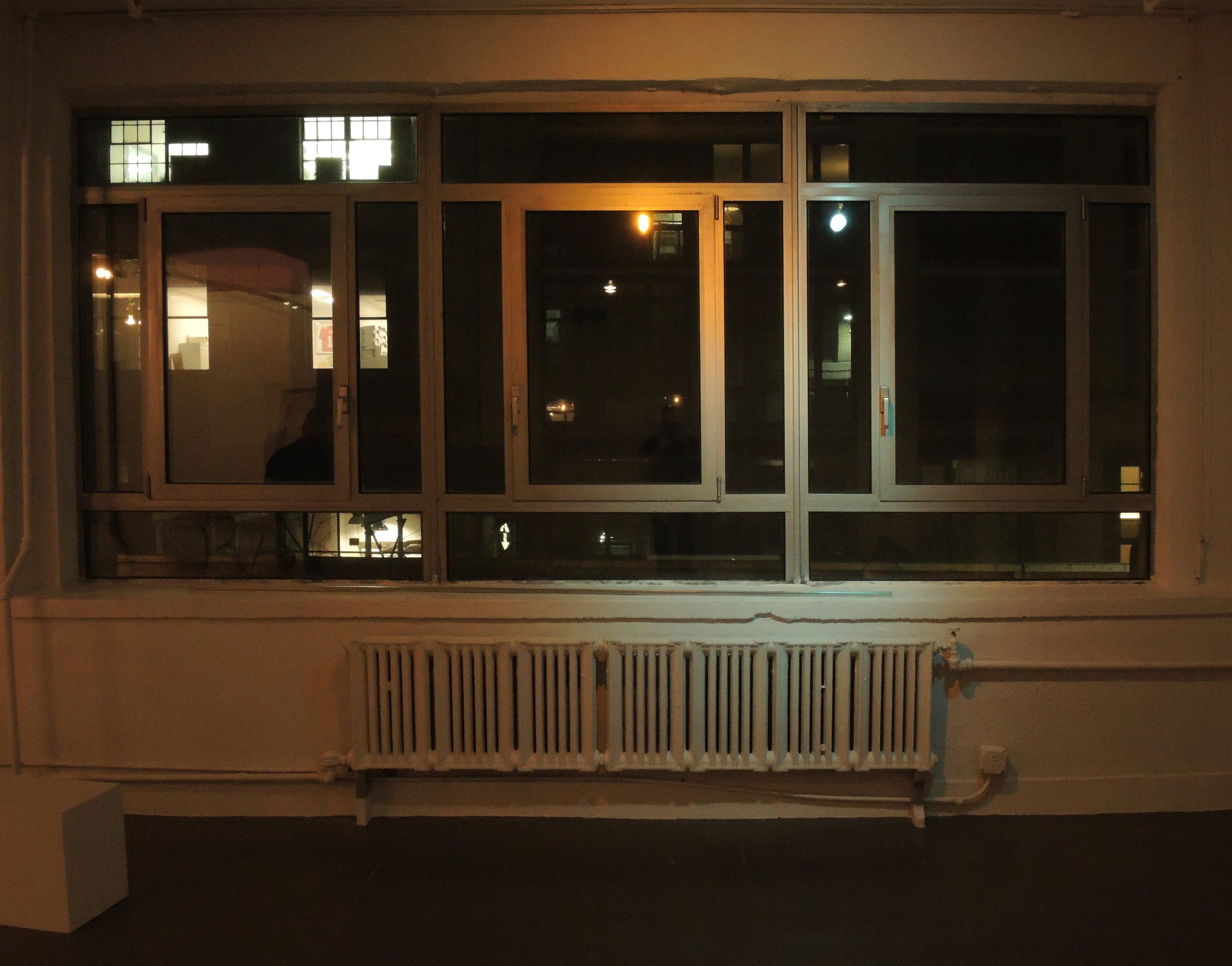 Warm light vs. cold light converge on the window frames. 