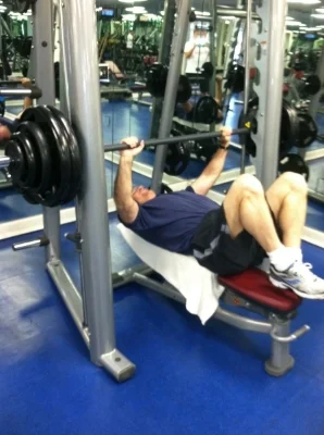 A quick shot of me ready for a serious rep @300. Notice the feet up on the bench for back support. Wise lifting.
