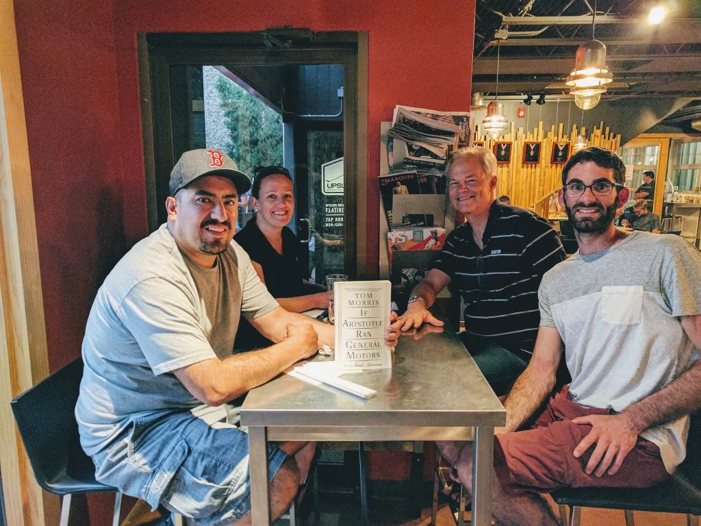 A book group at the immensely popular company Popsockets (PopSockets.com), reading If Aristotle Ran General Motors!
