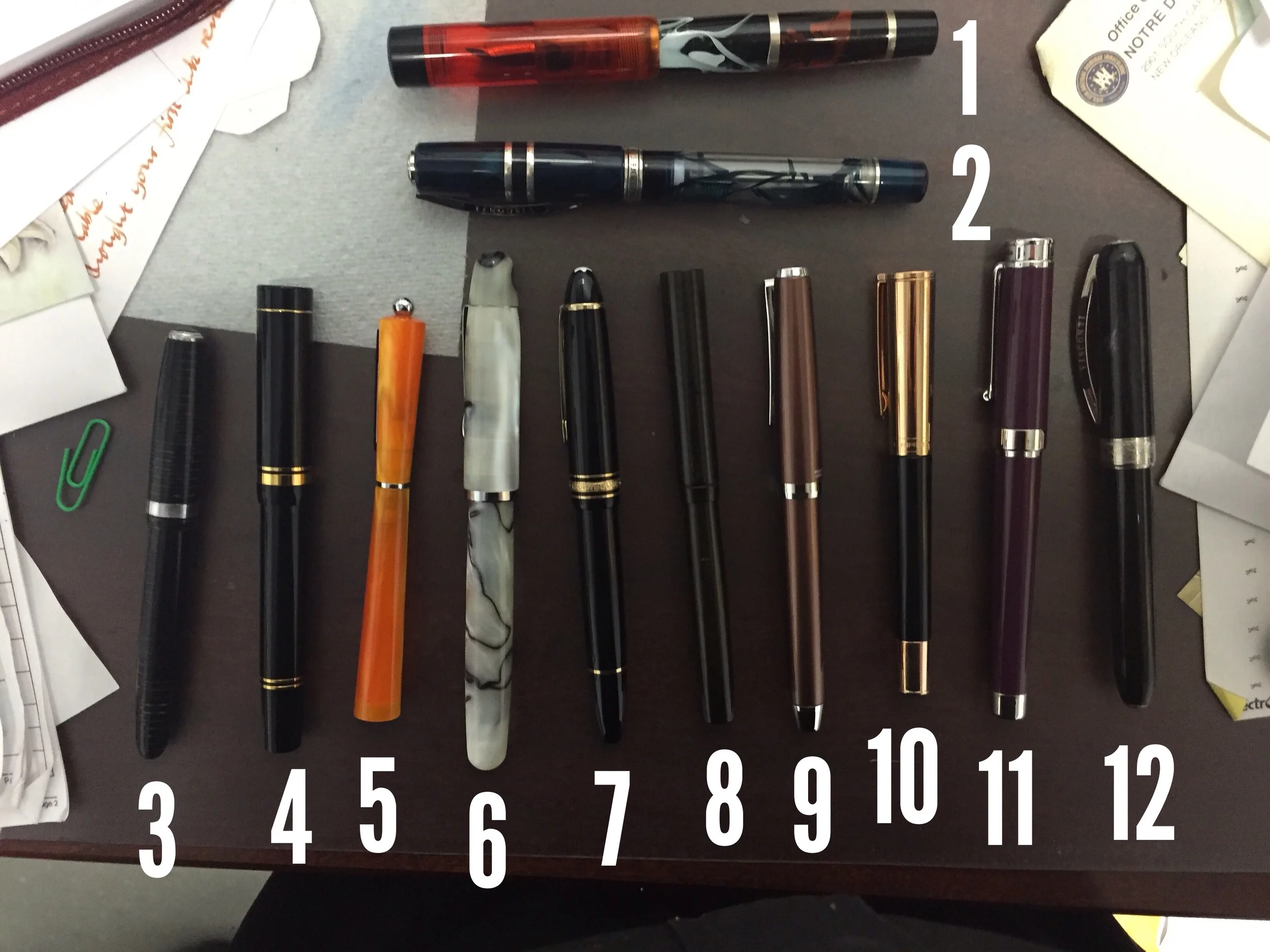 1) Shawn Newton Orange Oil Slick Gibby 2) Visconti Homo Sapiens Crystal 3) Parker Vacumatic 4) Parker Duofold 5) Giuliano Mazzuoli Moka Chiaroscuro 6) Noodler's Neponset 7) Montblanc 146 8) Moore Lever-Filler w/ Flex nib 9) Pilot Metal Falcon 10) Aurora TU 11) Montegrappa Parolo 12) Visconti Rembrant