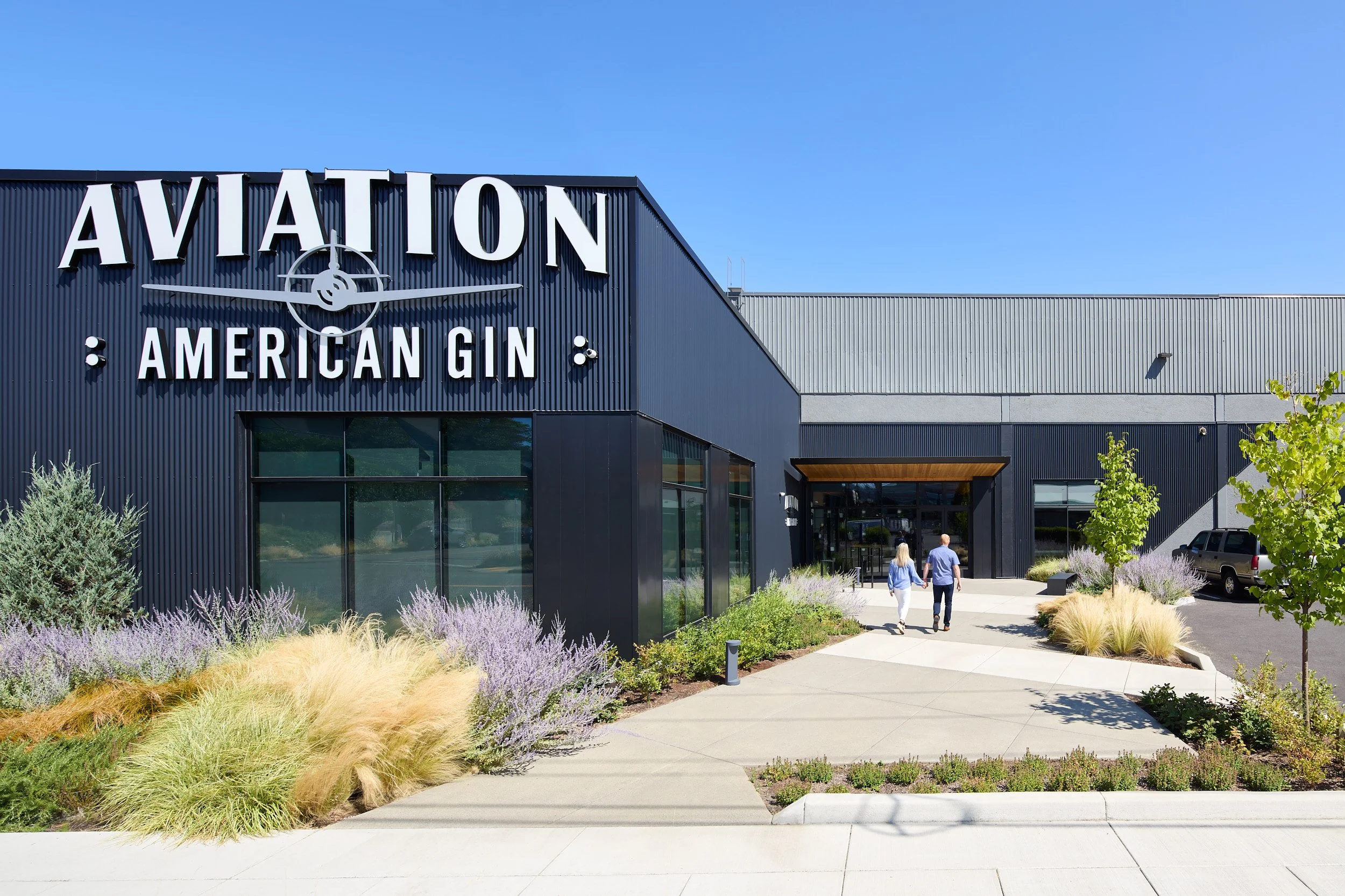 Exterior architectural photography of the modern Aviation American Gin Distillery and tasting room building in Portland, Oregon, designed by fi architecture.