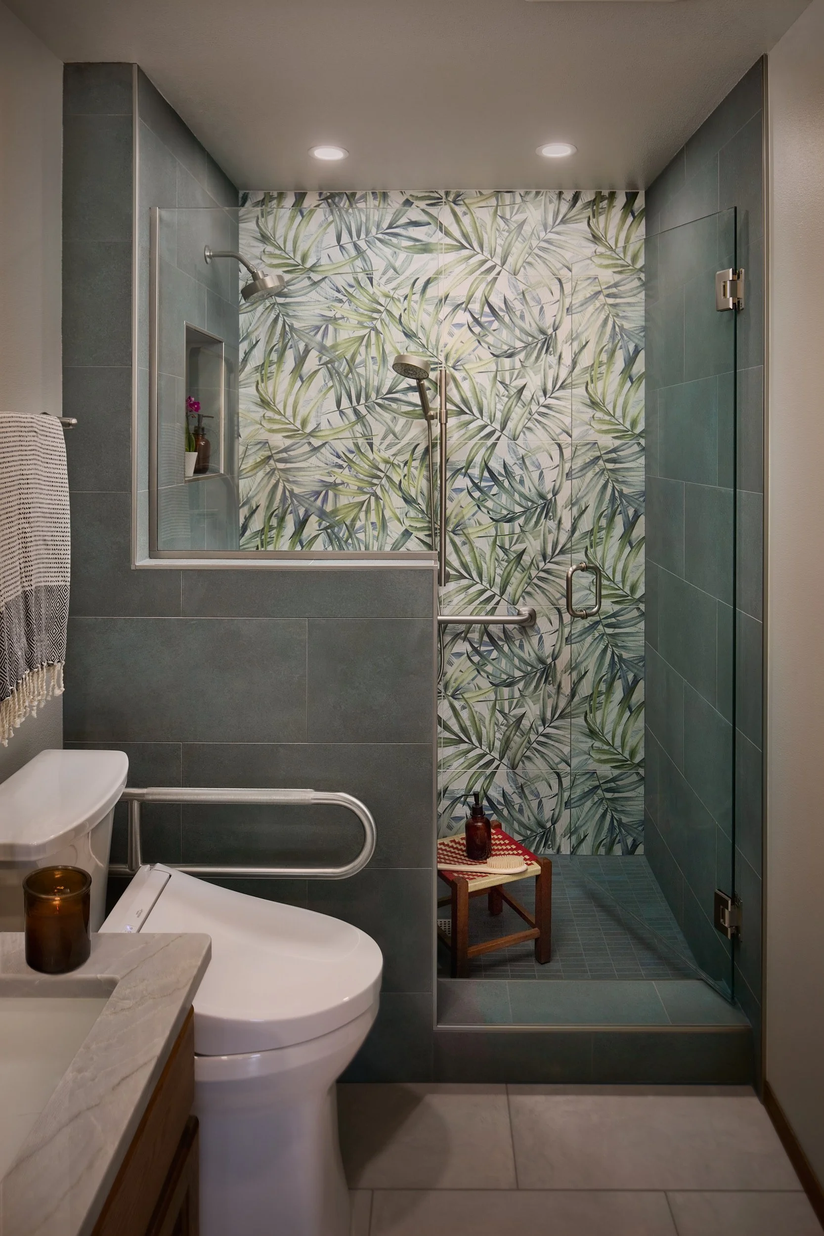 Upstairs custom bath and shower installation in a Pattison Lake, Olympia, WA residence, featuring large format tile and frameless glass enclosure, executed by Brown Building Contractors.