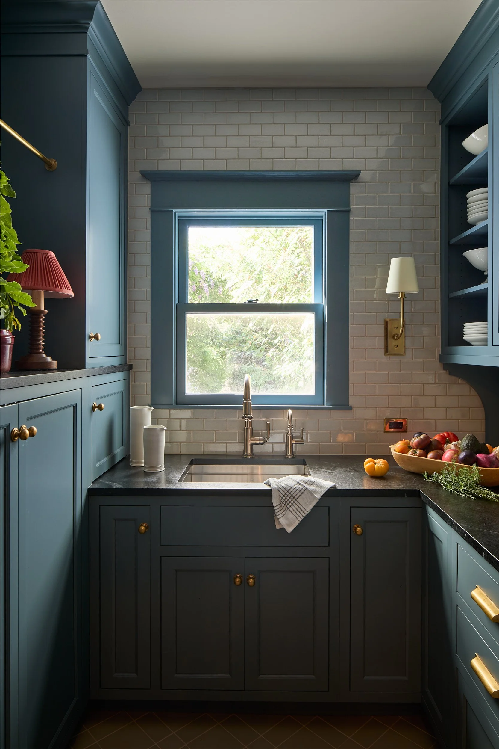 Moody pantry interior in the Old Tacoma Residence, featuring Woodharbor Cabinetry, Quemere Designs tile, and custom fixtures by Cupboard & Clay and Sonju Interiors.